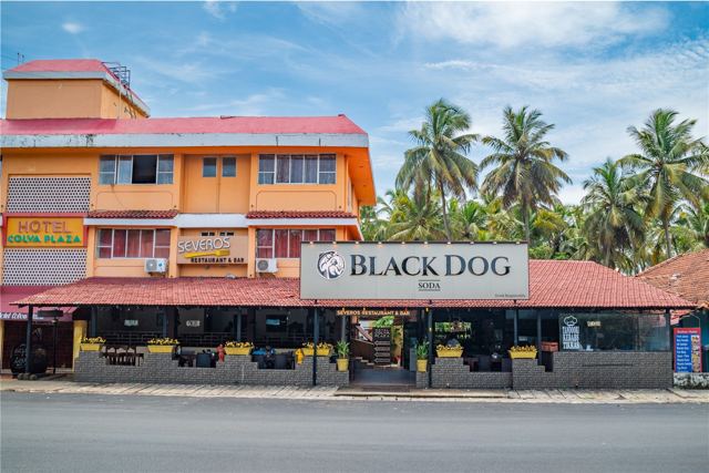 Hotel Colva Plaza front facade with Black Dog signage