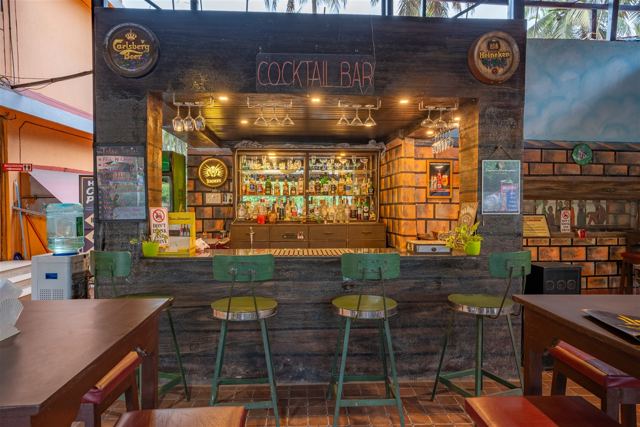 Cocktail bar counter with bar stools