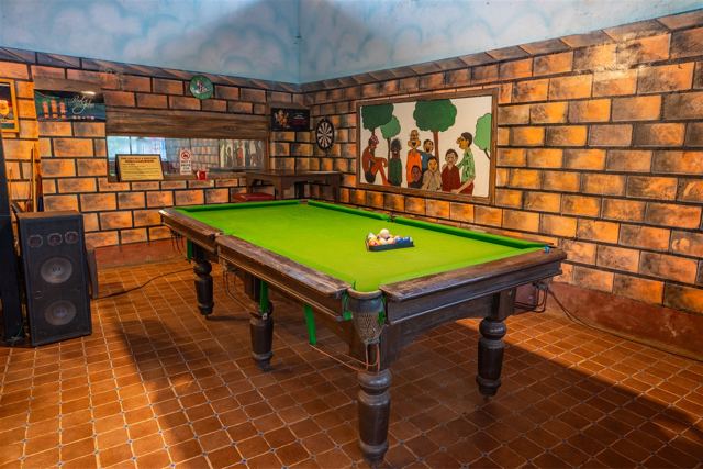 Pool table with brick-wall decor