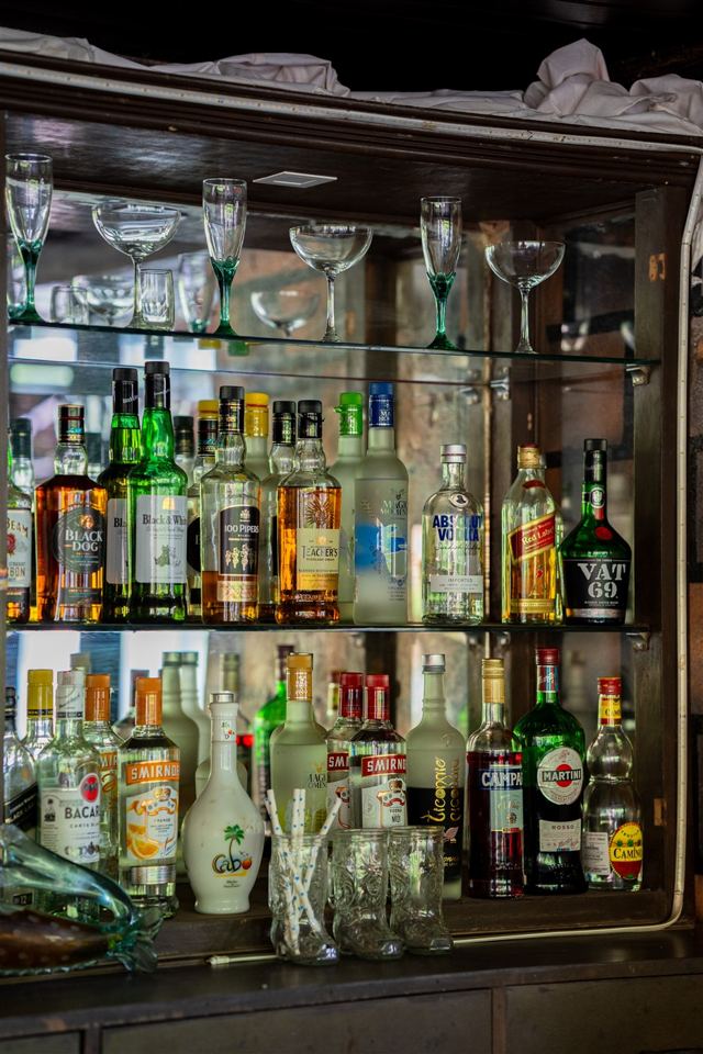 Bar shelves stocked with spirits