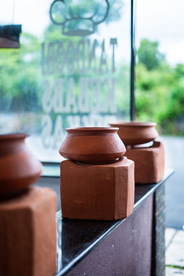 Clay pots by the restaurant window