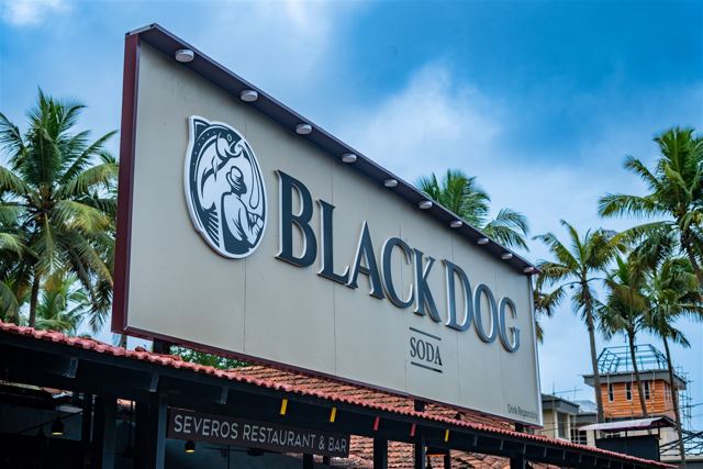 Black Dog signboard outside the hotel