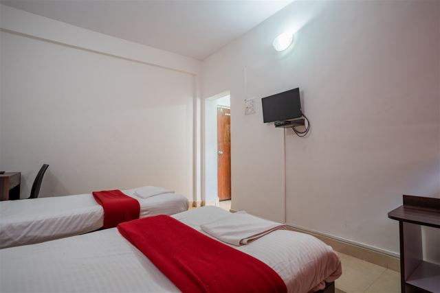 Twin bed room with flat-screen TV